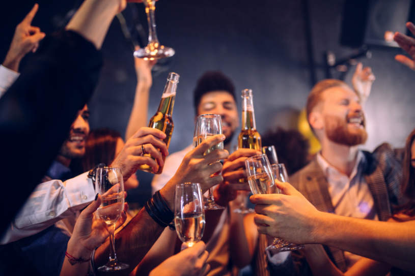 a group of people drinking in a party