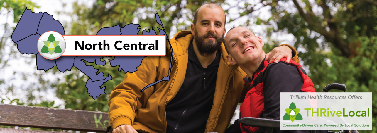 a man sitting in a bench and a young man in a wheelchair smiling at the camera