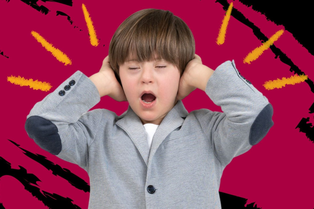 a kid with Down Syndrome covering his ears because den noise