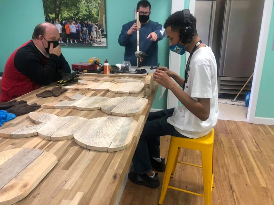 Young man working in wood