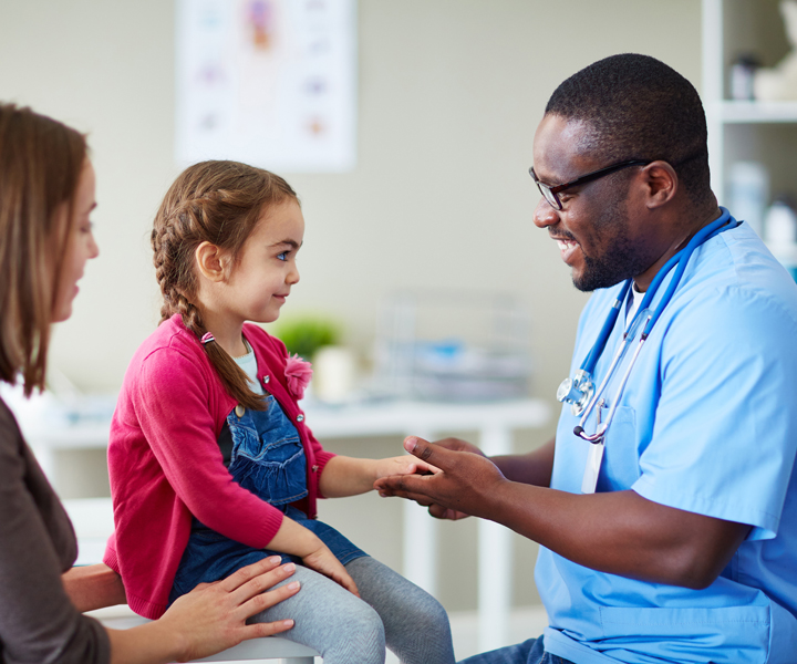 a doctor with a girl and the mother