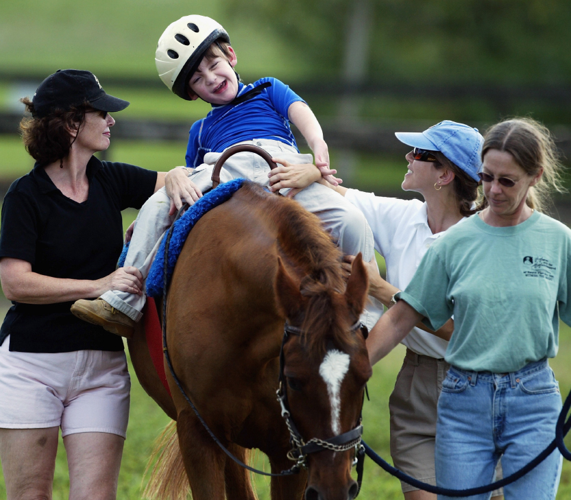 boy riding a horse