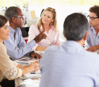 meeting with people sitting in a table