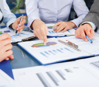Business group discussing over graph during a meeting