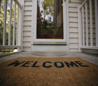 Outside door with welcome mat