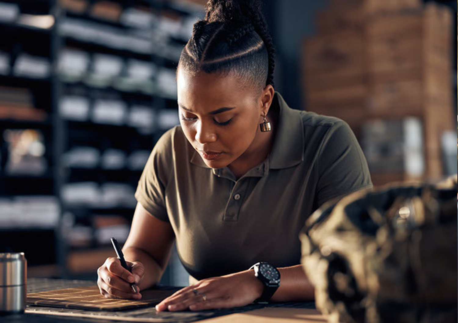 A woman working on a piece of equipment