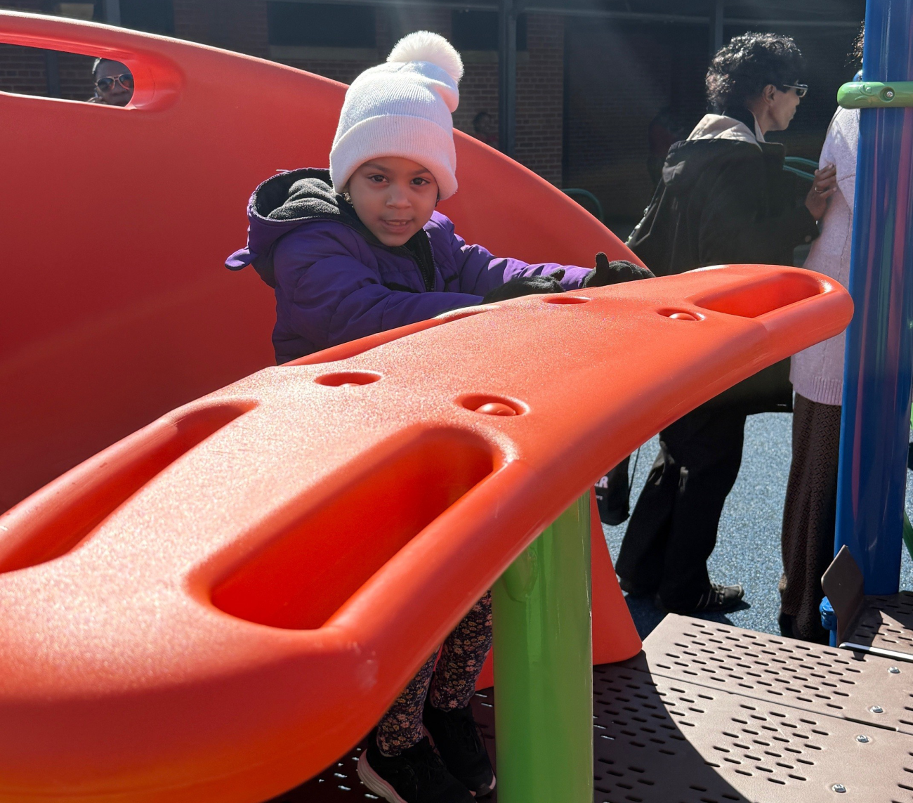 Kid playing the merry-go-around