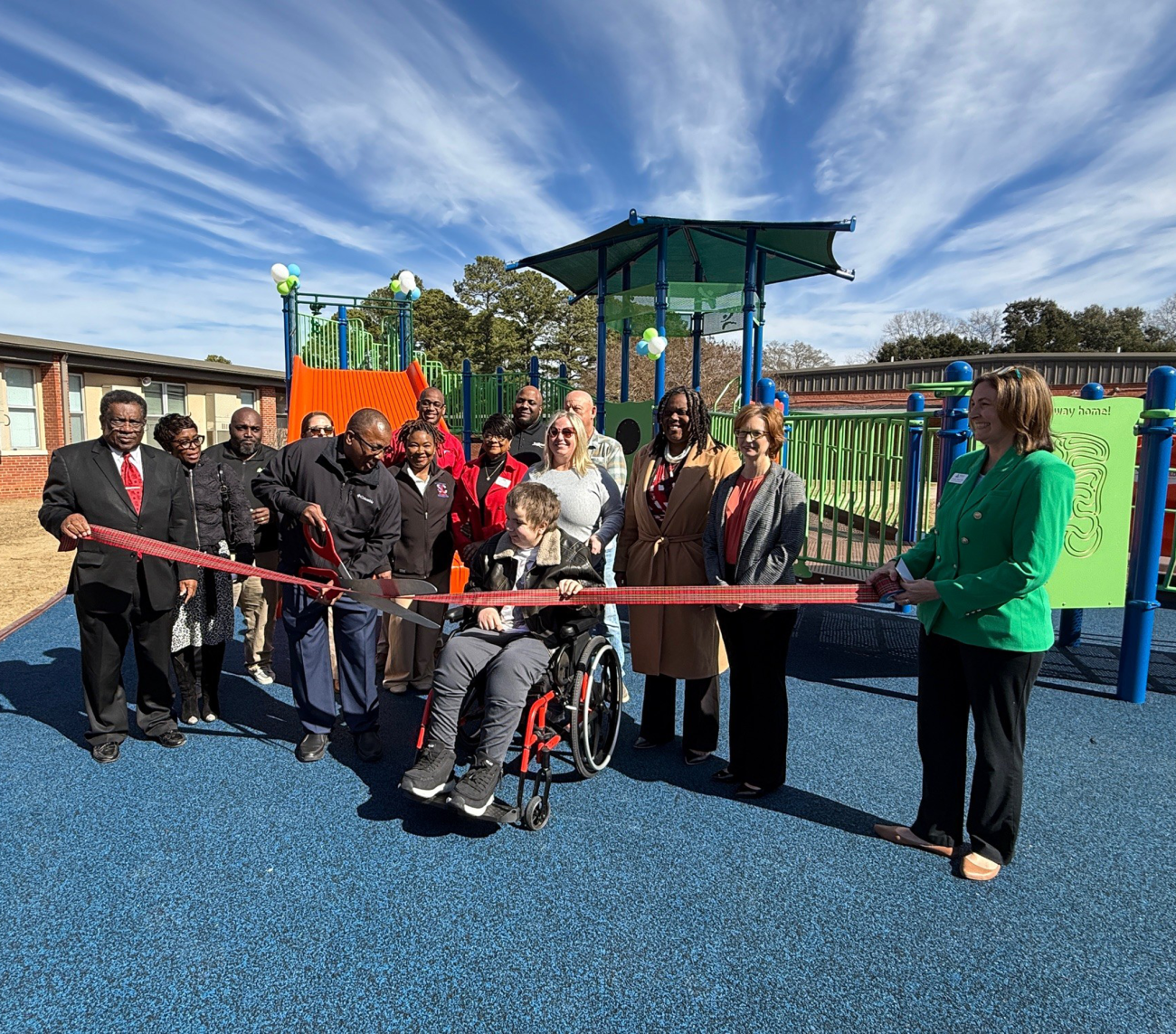 Group of peopple cutting Ribbon the Scoltland playground