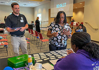 A group of people infront of the registration table for the Re-Entry Training