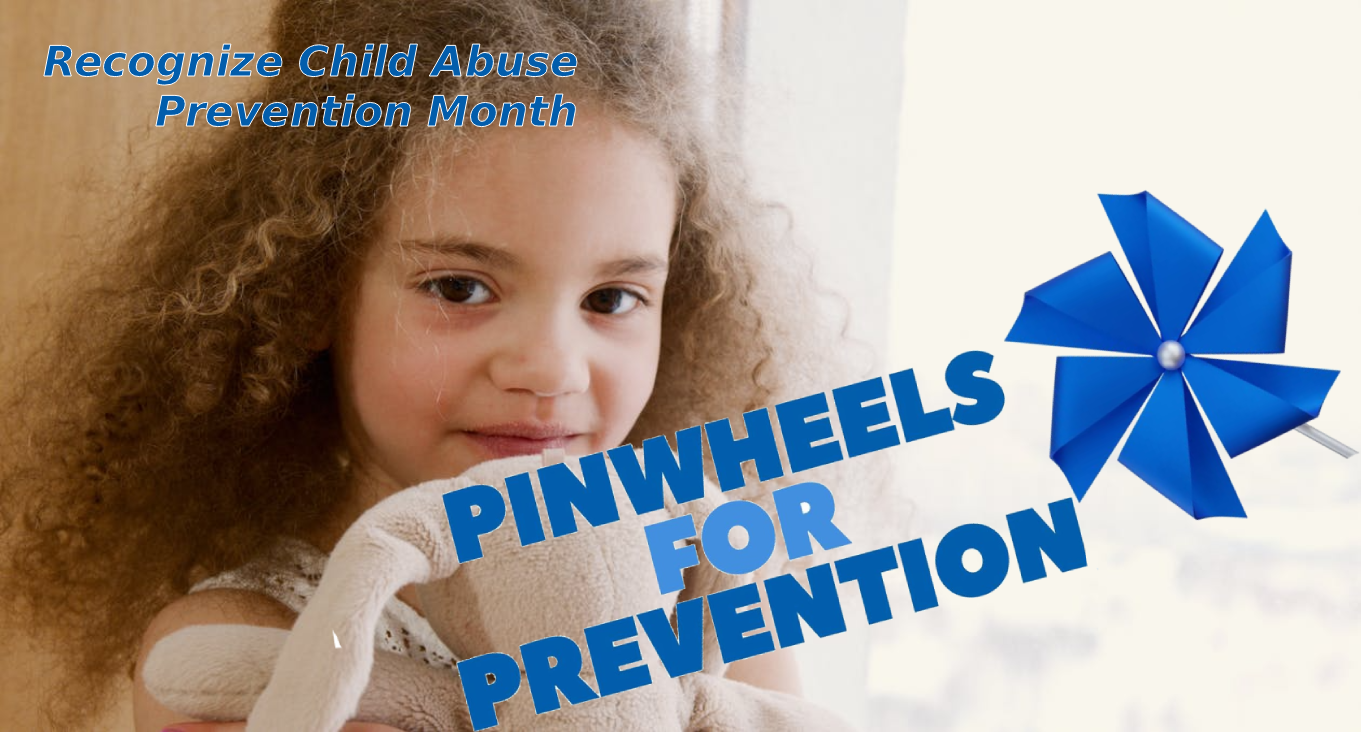 A girl with a stuff animal smiling to the camera